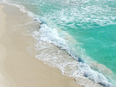 Draw names and hearts on the sand...